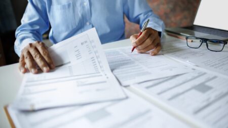 Accountant reviewing documents at desk