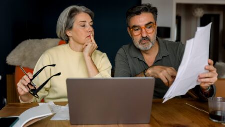 Couple analyzing finances and retirement planning