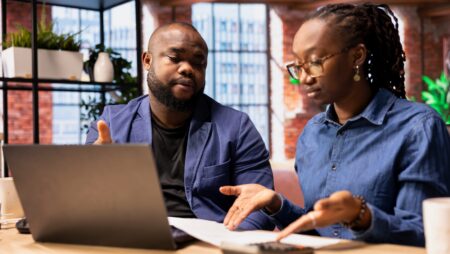 Couple analyzing finances financial stress