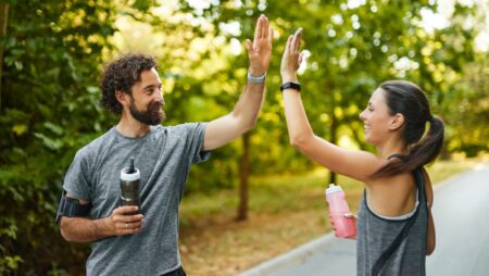 Couple jogging achieving wellness goals