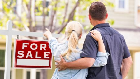 Couple outside buying house