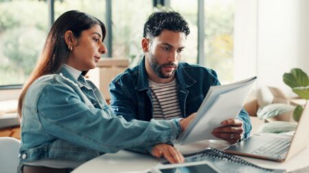 Couple reviewing home loan paperwork