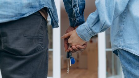 Couple with house keys joint ownership property
