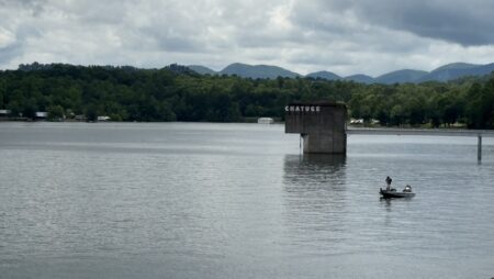 Century 21 Black Bear Realty dam sign and boat