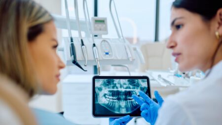 Dentist discussing x-rays with patient