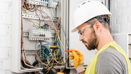 Electrician checking electrical box