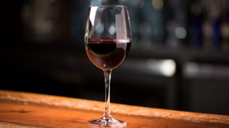 Glass of red wine on bar