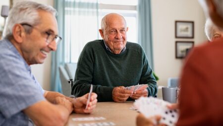 Group of seniors playing cards