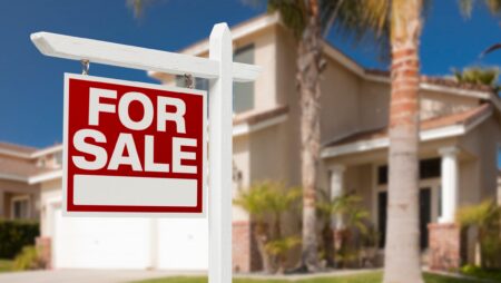 Home with for sale sign