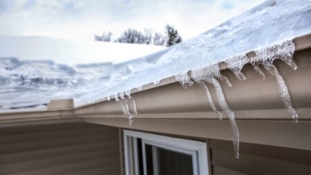Ice dam in gutter frozen roof