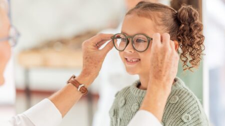 Kid getting glasses at eye doctor