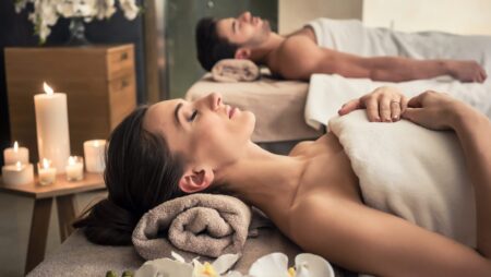 Man and woman on massage beds wellness center