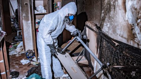 Man cleaning up from house fire