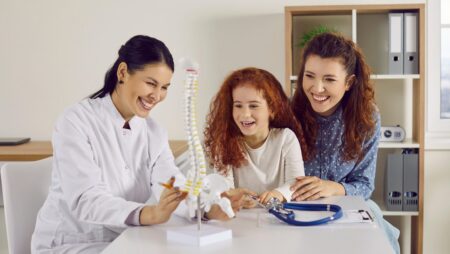 Mother with daughter at chiropractor appointment