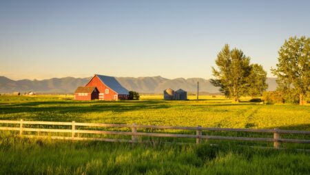 Red barn rural Montana summer sunset
