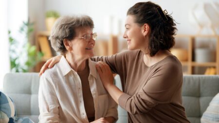 Senior mother and daughter personal care transition