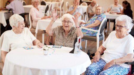 Senior women sitting at table in retirement home
