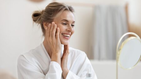 Smiling woman anti-aging face skin hydration