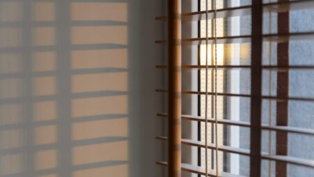 Sunlight shining through wooden blinds