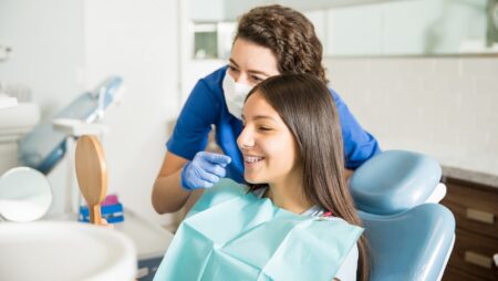 Teenage girl with braces at dentist