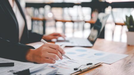 Woman at desk working on finances and taxes