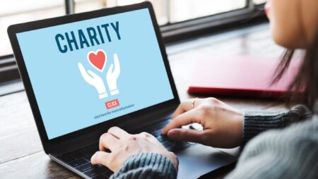Woman donating to charity on laptop