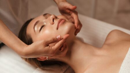 Woman getting facial spa treatment