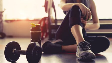 Woman working out in gym new exercise routine