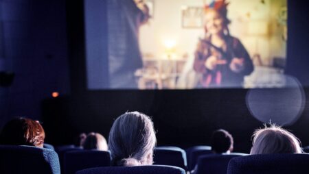 Watching Movie In Cinema