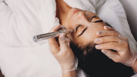 Upper view of ca skin care procedure made with modern apparatus at the spa salon Sundhari Spa
