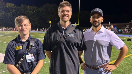 Athletic trainers on football field Bone and Joint Institute of Tennessee