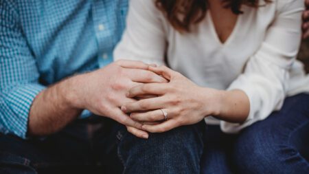 Couple holding hands trust