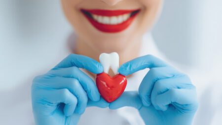 Dentist holding heart and tooth