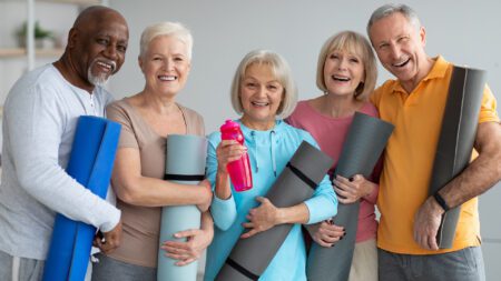 Group of seniors working out yoga mats