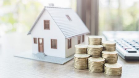 House and coins home wealth