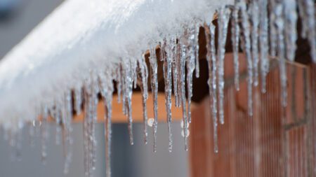 Icicles hanging off house roof
