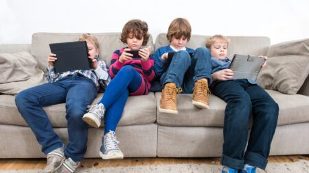 Kids on phones and tablets