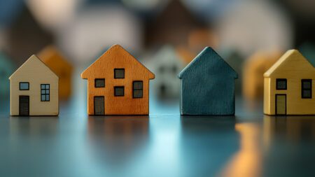 Little houses on table real estate