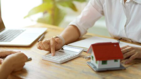 Real estate agent explaining home buying costs