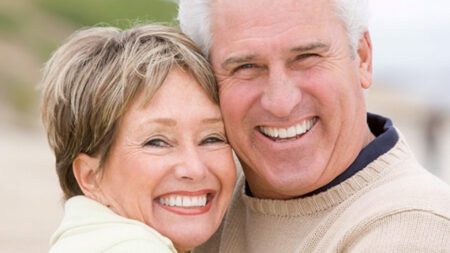 Senior couple smiling with white teeth River Ridge Dental
