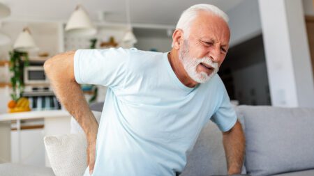 Senior man lower back pain sciatica