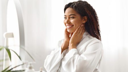 Woman touching face at spa