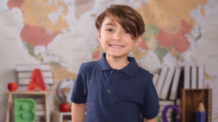 Young student in school uniform