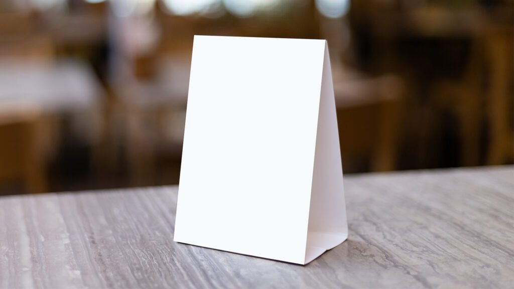 The Silent Salesperson: Why Your Table Tents Need Photos, Not Paragraphs