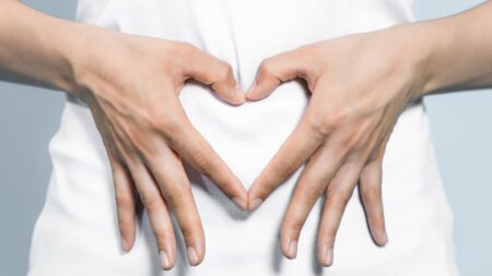 Heart hands over stomach colon health