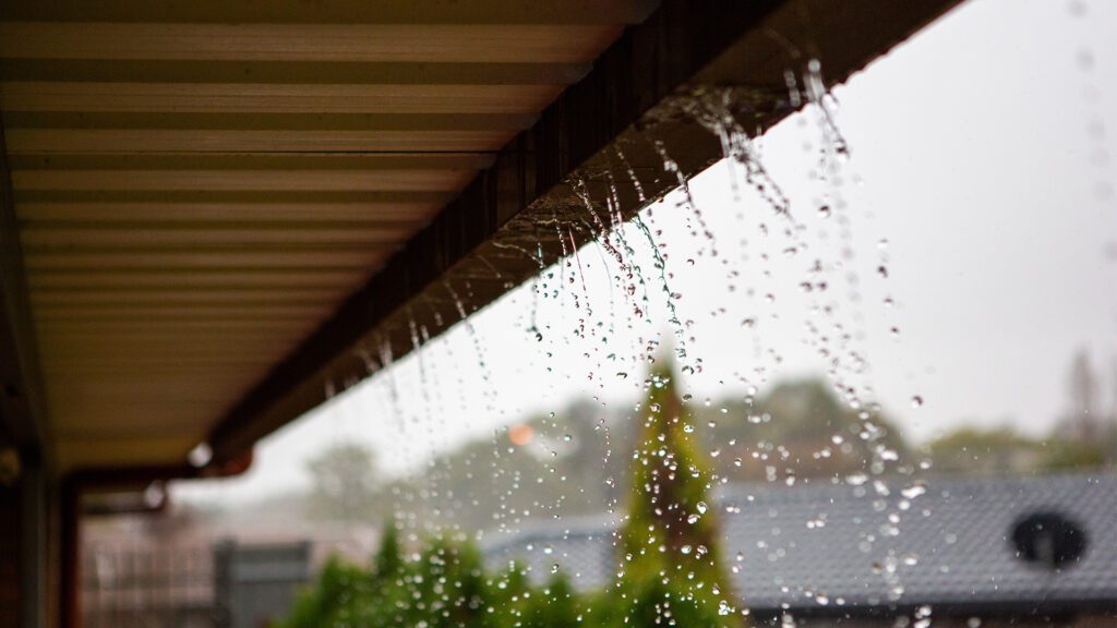 Why Your Gutters Overflow in Heavy Rain (and What It Really Means)