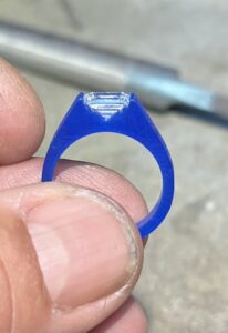 Ross Goldsmith fitting the stone in the ring