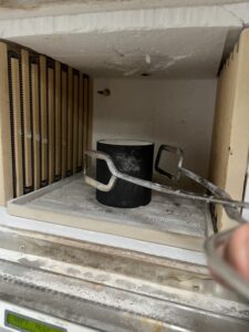 Ross Goldsmith cooking the wax out of the plaster