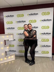 Evolution Dance dancers hugging