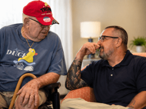 Soter Senior Living & Family Advocates elderly resident talking